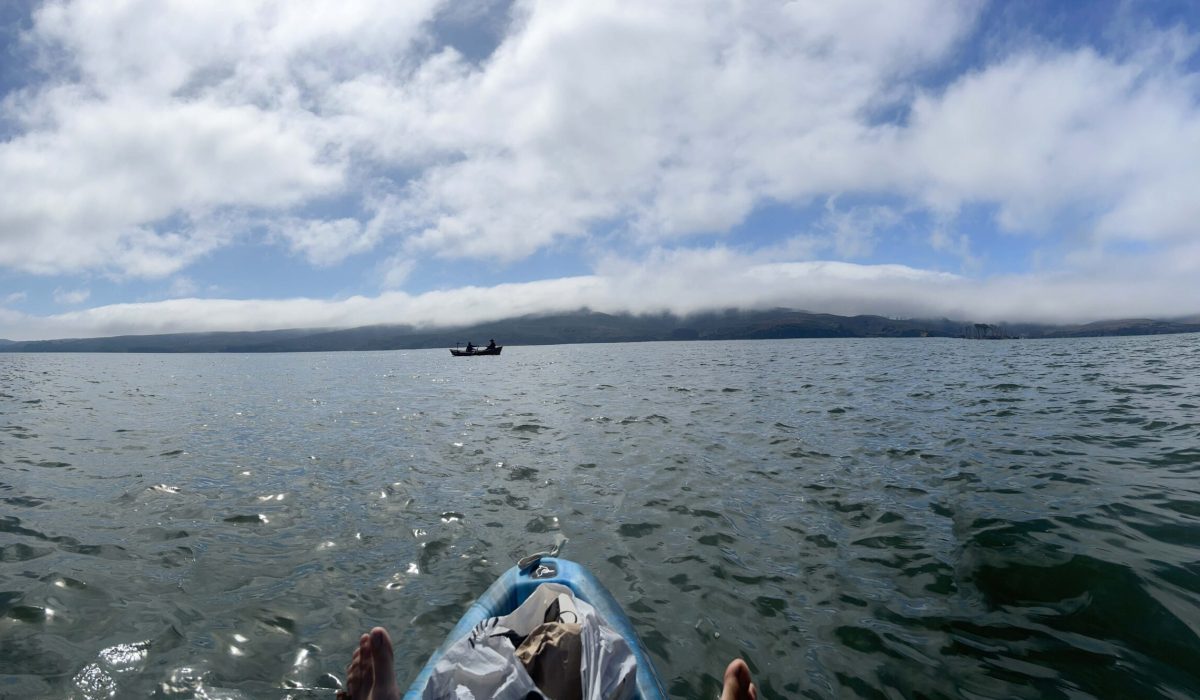 Panoramic view of Tomales Bay and Point Reyes Peninsula from the water, with a bit of the blue nose of my Pelican Kayak showing at the bottom of the image